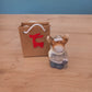 Figurine Noël dans sac