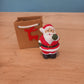 Figurine Noël dans sac