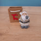 Figurine Noël dans sac